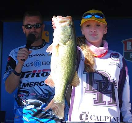<p>Briana Tucker shows off the Big Bass of the tournament, and 5.47-pound monster.</p>
