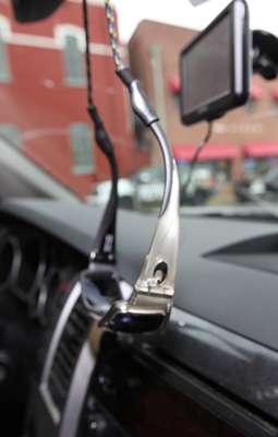 <p>His rearview mirror holds an extra pair of sunglasses and below it a GPS is ready to get him to his next destination.</p> 