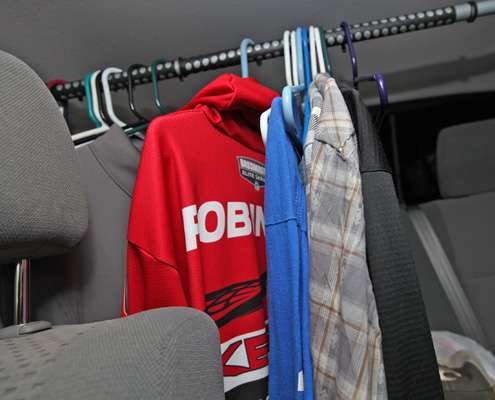 <p>Robinson keeps extra jerseys, shirts and cold-weather gear on a backseat clothes bar.</p> 