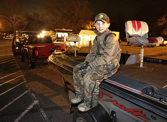 Colby Edwards waits for his grandfather, Stephan Evans, to launch their boat.