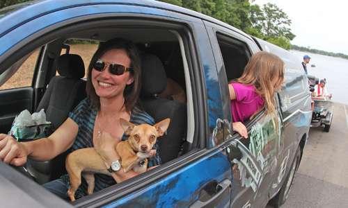 <p>Bobbi Chapman, along with dog and daughter, pull Brent Chapman, 2012 Toyota Angler of the Year, from the Alabama River. The wife and kids were there waiting for Chapman to check in, allowing him to simply motor up and get on the trailer.</p>
