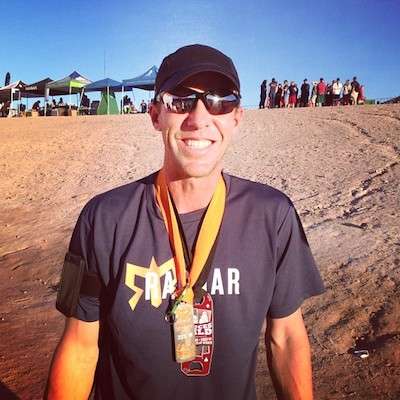 <p>If you spend any time with Aaron, you learn he's a fitness freak. Here he is celebrating finishing RAGNAR, a multiple day relay race through the Las Vegas desert.</p>
