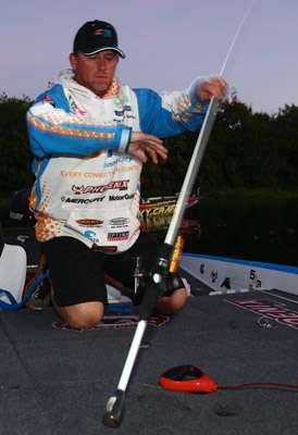 J. Todd Tucker pulls his rods from the rod locker in preparation for Day One.