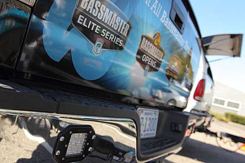Bassmaster tournament logos are prominent on his truck wrap.