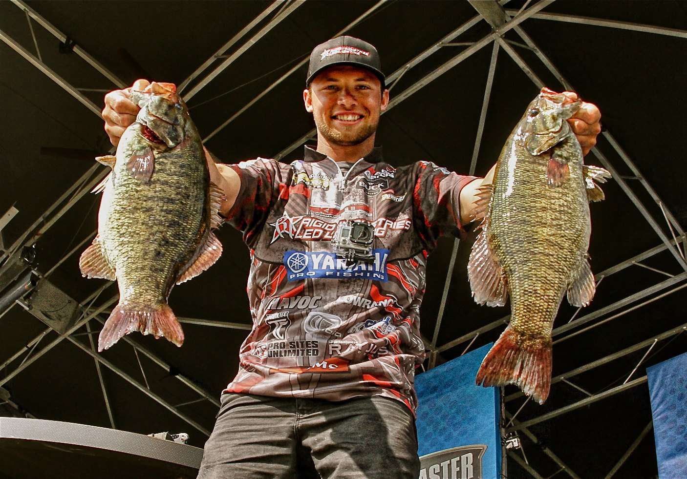 Brandon Palaniuk holds two big smallmouth bass from his Day Four bag of 23-5 that clinched his victory at the St. Lawrence River and cashed his ticket to the 2014 Classic. 