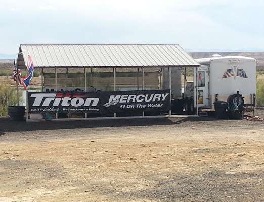 <p>A canopy next to the weigh-in trailer provides shade for anglers, spectators and the bass tanks.</p>
