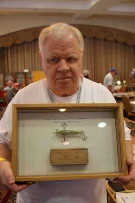 <p>Heddon was one of the earliest names in American fishing lures, and it's the brand that Mark W. Hostetler collects. Here he is with a Heddon "High-Forehead" 175 Heavy Casting Minnow "177" with a wood box. James Heddon was the first to patent a wooden bait or "plug" in the U.S. back in 1902. Hostetler recommends buying the best item you can afford to ensure that its value holds up over time.</p>
