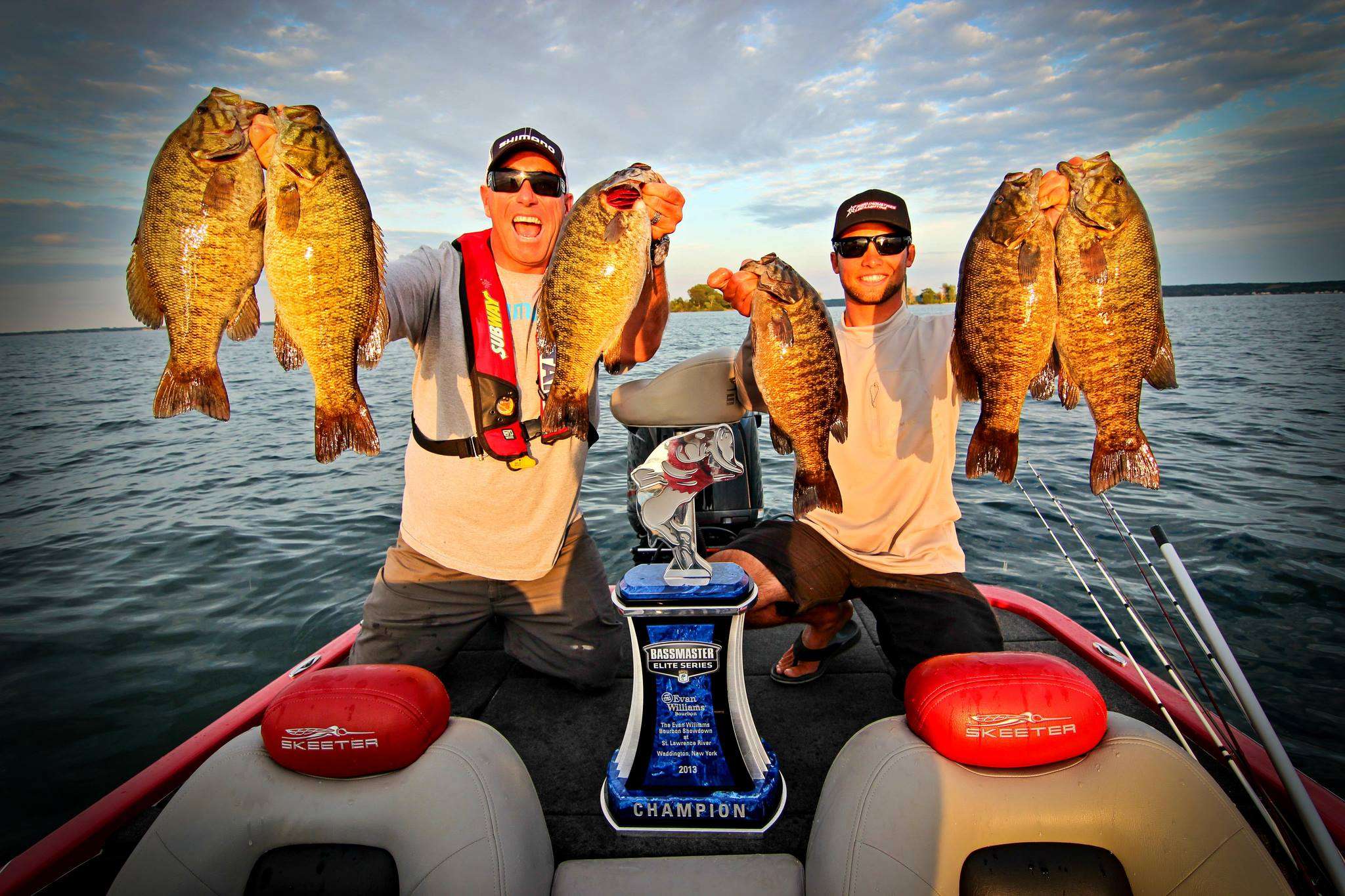 Bassmaster Elite Series emcee Dave Mercer and Palaniuk hold up the smallmouth they caught the day after Brandon won the St. Lawrence River Showdown. Palaniuk led the tournament from start to finish. 