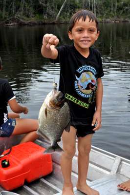 <p>The young son of a camp staff member caught this piranha on a hand line. The fish contributed to a fine meal that evening. </p>
