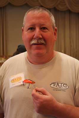 <p>Craig Comjean of Acton, Mass., has one of the finest collections of Bagley baits in the world. He's especially proud of the lures he owns that came out of Jim Bagley's personal tacklebox. The bait he's holding is a 2-inch uncatalogued Deep Diving Hustle Bug in an uncatalogued color. It's a prototype that's ready for production, but never quite got to the production stage.</p>
