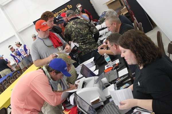 B.A.S.S. tournament officials work hard to register anglers. 
