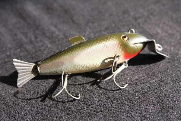 <p>Here's the Creek Chub Fintail Shiner in the color Perry allegedly used to catch his record bass. There were two versions. One had rubber fins and the other had metal fins. As you might expect, the rubber fins didn't hold up well over the decades. This bait is from the author's "collection."</p>

