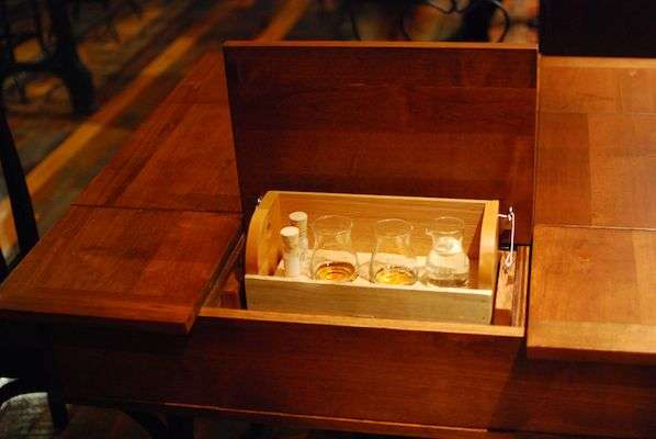 During the tasting you open a secret compartment in your table to reveal bourbon.