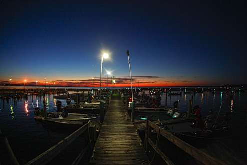 The docks begin to line with boats as the sun begins to rise on Lake Toho. 