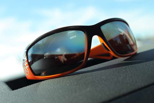 His signature orange sunglasses. 