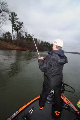 7:41 a.m. Shryock opts to probe shoreline wood cover with a jig.
