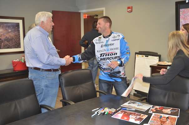 B.A.S.S. co-owner Don Logan shakes hands with the newest Bassmaster Classic champ.