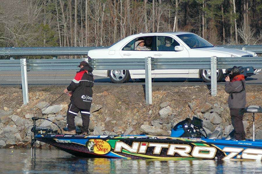As DeFoe fished a shallow running crankbait tight to the bank, fans pulled over and watched from the highway.
