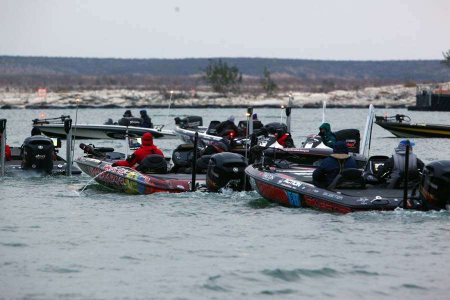 The boats line up to pass through the no-wake zone and speed to their fishing spots. 
