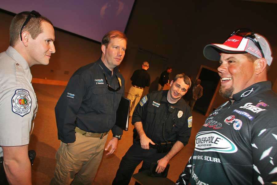 Chris Lane jokes with some of the law enforcement assisting with the tournament. Trip Weldon ribbed Lane during the angler meeting that he couldnât fish until he paid off some parking tickets in his hometown of Guntersville.