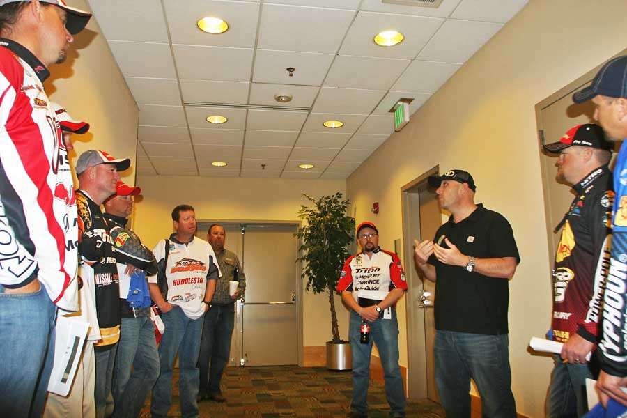 Bassmaster emcee Dave Mercer gives some of the Classic first-time entrants tips on how to carry themselves on stage during the weigh-ins.