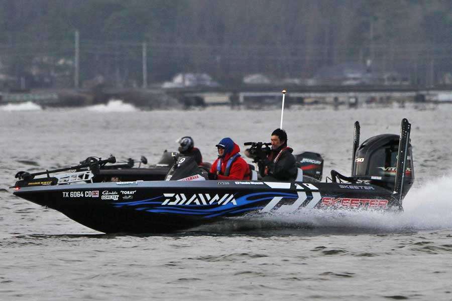 Yusuke Miyazaki takes off with a Japanese cameraman in his boat.