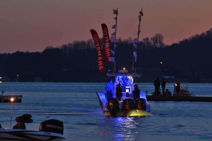 A boat from Yamaha lights the way into City Park.