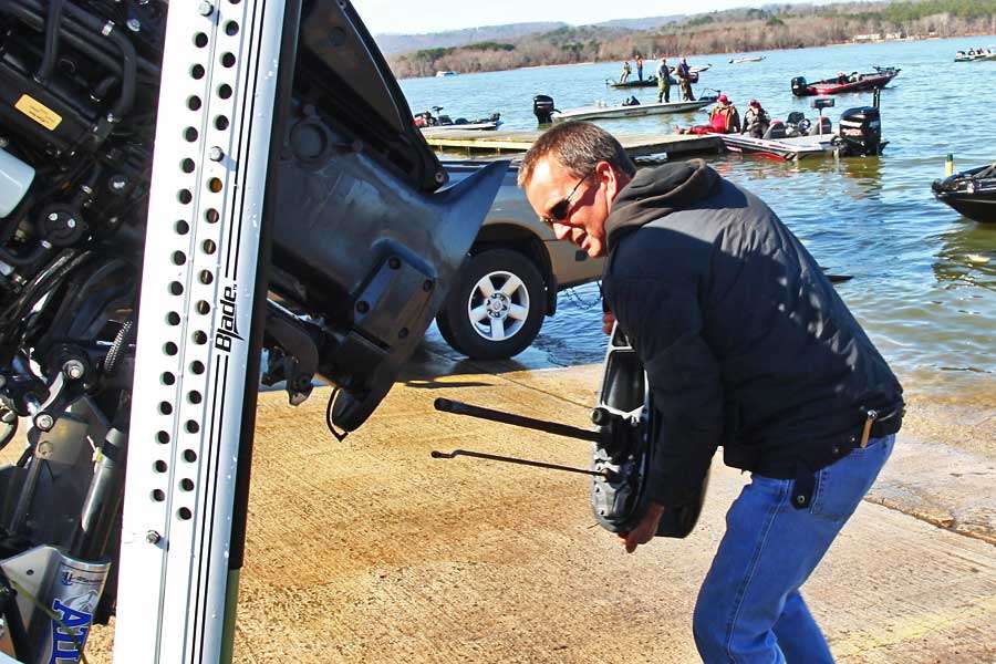 The tech lines up the driveshaft to put on the new lower unit.