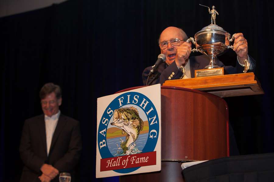 A night filled with fun.  Bobby Murray passes his Classic trophy to the Bass Hall of Fame.