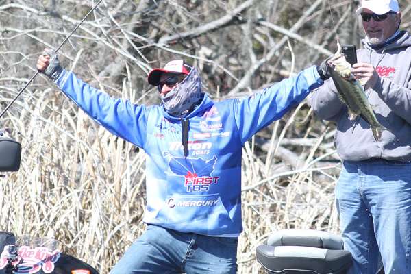 ... then jumps up in jubilation. The fish guaranteed him 10 pounds, giving him a 20-pound average over two days.
