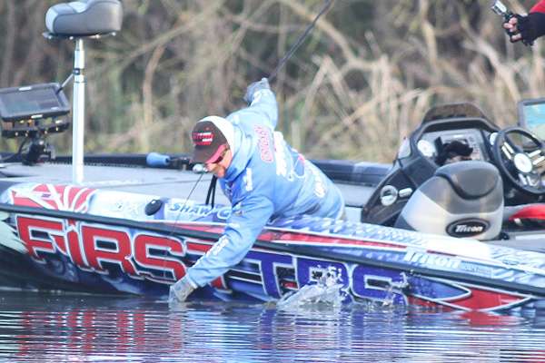 Grigsby reaches for the fish, but it speeds past him.