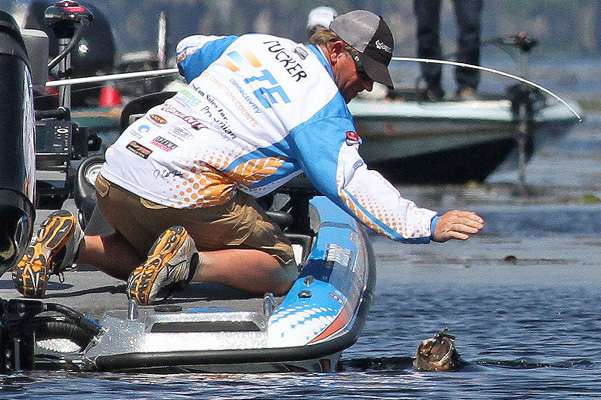 J. Todd Tucker battles a quality fish at the side of the boat.