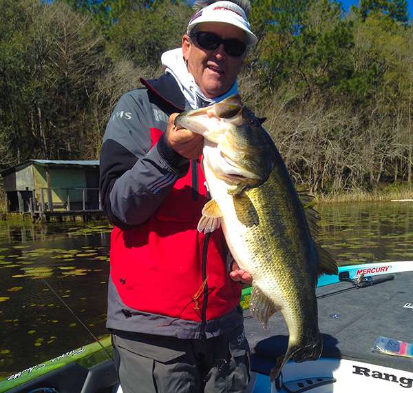 Bernie Schultz holds this huge bass that weighed in at 10-10 for Carhartt Big Bass of the tournament.
