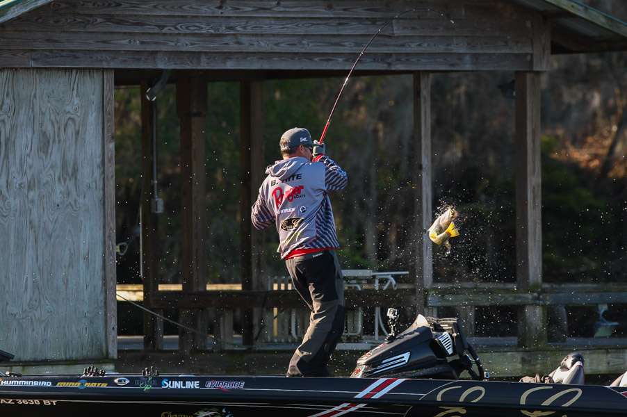 He swings this largemouth over the rail.
