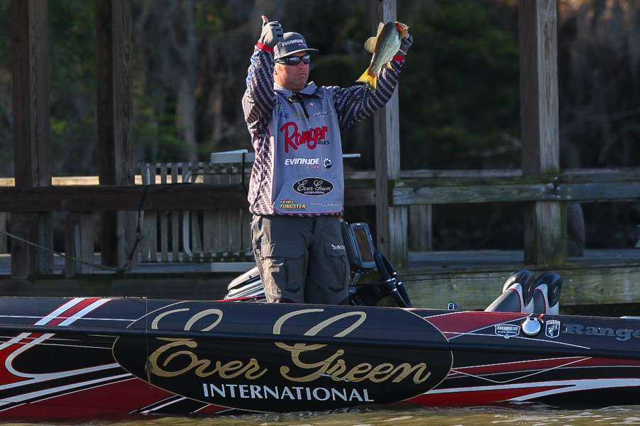 Hite shows off his fish to the spectator boats this morning.
