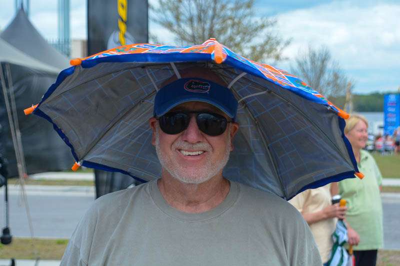 Frank (pictured) makes these umbrella hats himself. 