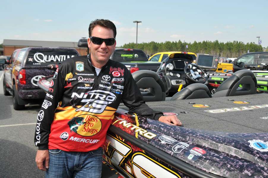 Kevin VanDam next to his signature Nitro. Up close you can see thousands of fans' faces on the boat wrap. 