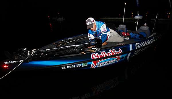 Todd Faircloth checks his rods and reels before takeoff.