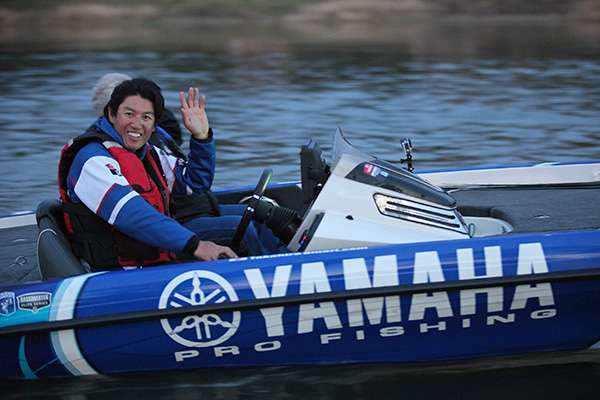 Takahiro Omori gives a final wave before launch.