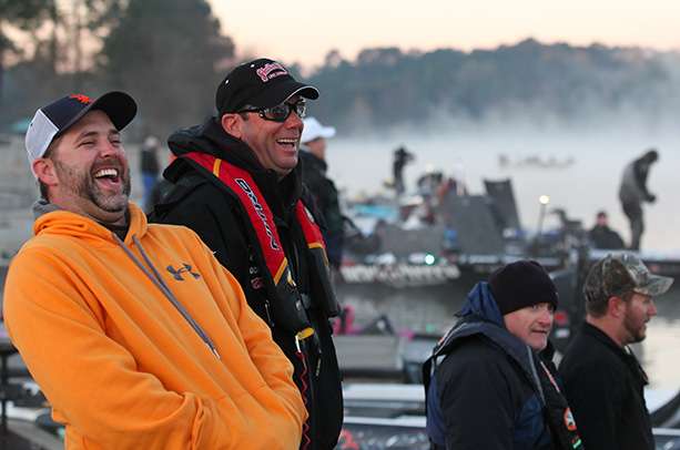 Kevin VanDam makes good use of the delay by talking with the Marshals and fans at the boat ramp.