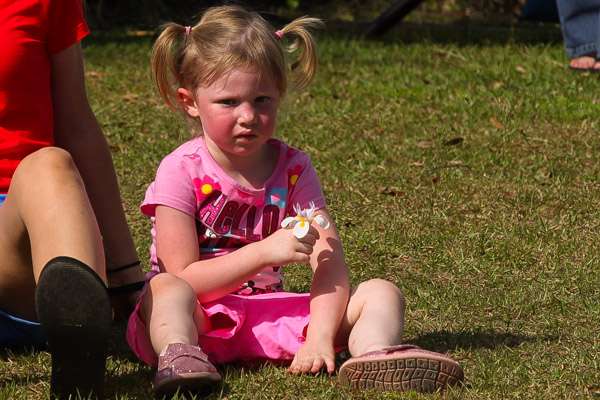 Bobby Lane's daughter holds a flower for him as she waits for him to exit the stage.