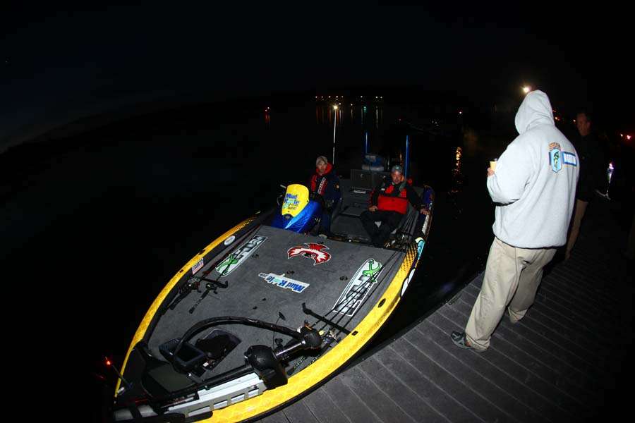 Brandon Lester goes through the safety check of his boat's equipment prior to takeoff.