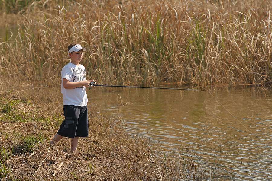A young angler fishes close to the venue.