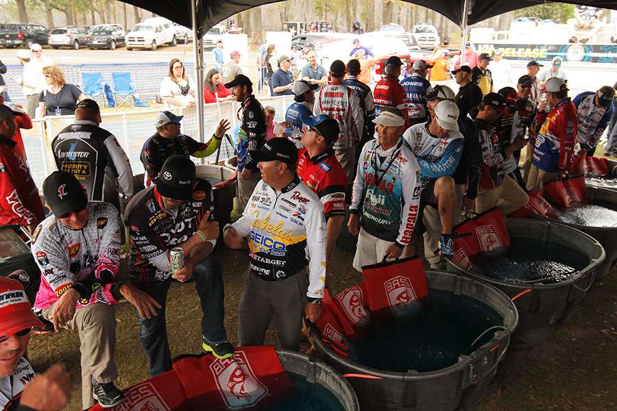 Anglers wait in line to weigh in.
