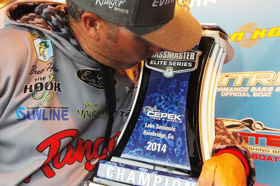 Hite kisses his Elite Series trophy.
