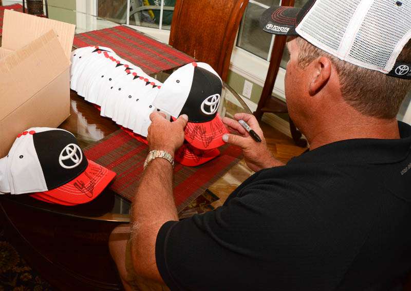 It's dinner time at the Terry Scroggins house. During the recent Elite Series tournament in Palatka, Fla., Terry Scroggins invited many of his fellow anglers over for a cookout. But first, Terry has to handle some business â signing these hats with his fellow Toyota anglers.