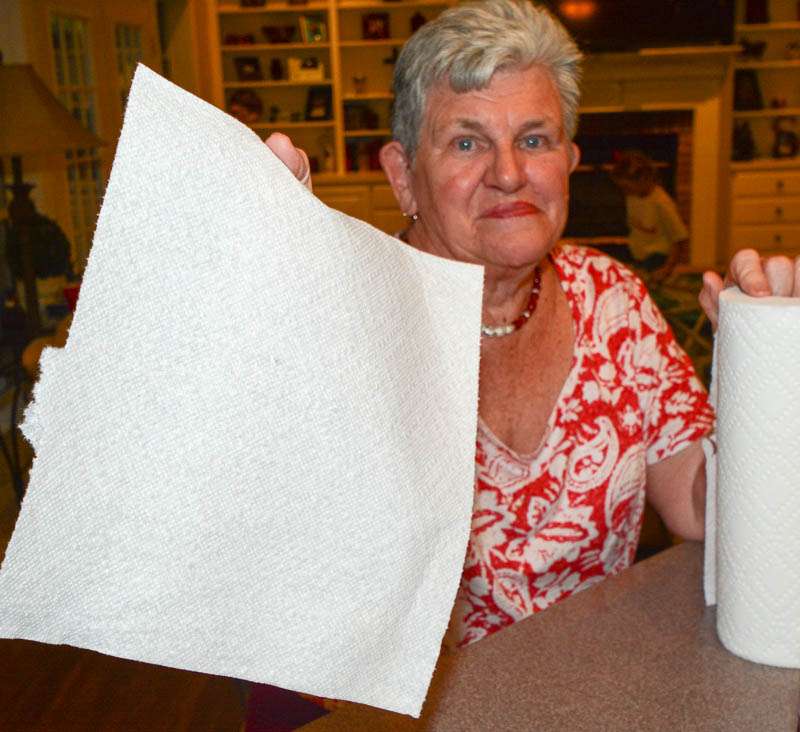 Here's Mrs. Nadine VanDam, Kevin's mom, offering paper towels to the rib eating anglers. 