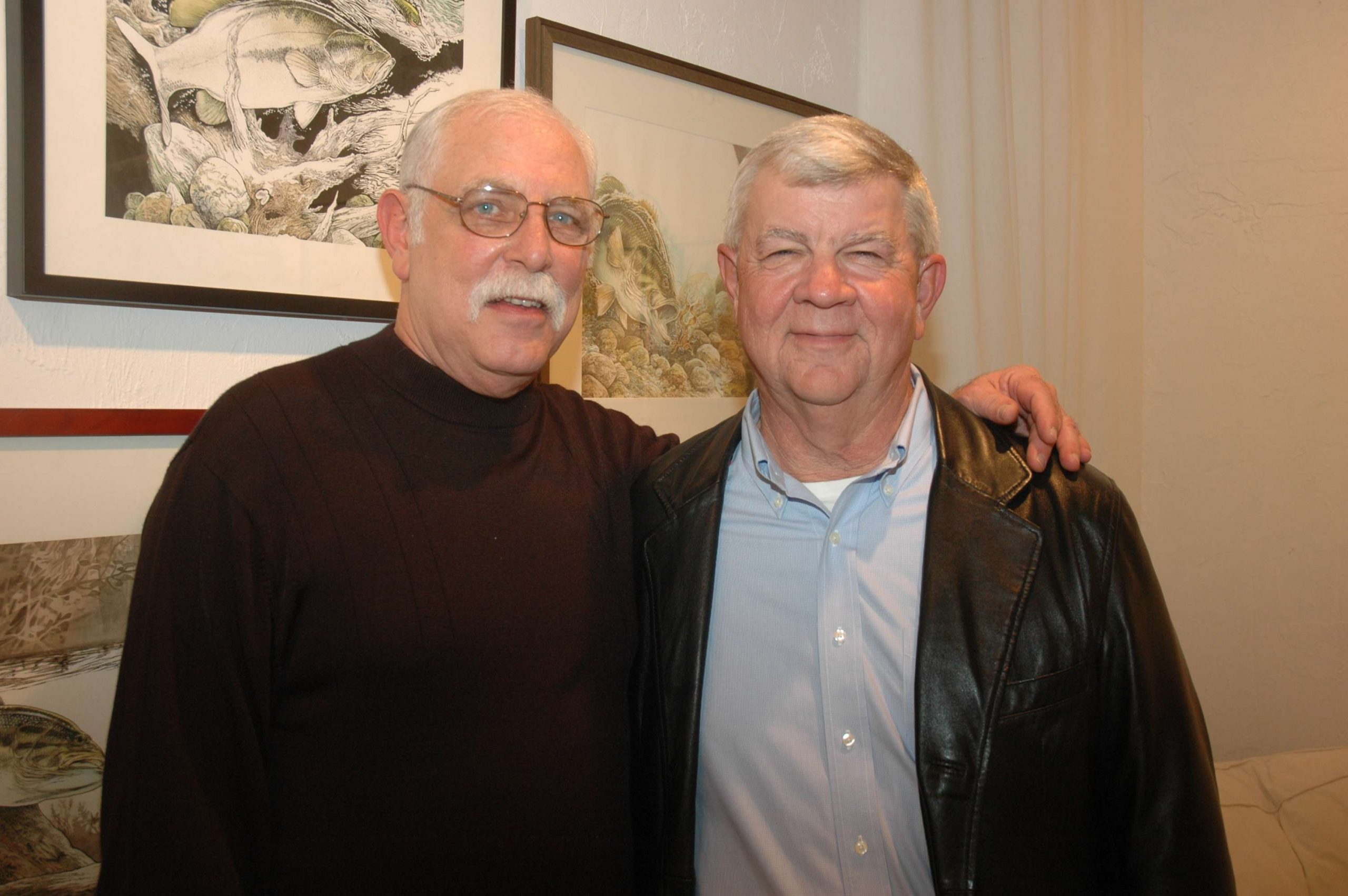 <p>Chris Armstrong, left, and Dave Precht go way back. Precht was the first editor at B.A.S.S. to hire Armstrong for his illustrations. He recognized Armstrong's incredible talent, and soon, the rest of the fishing and hunting world did, too. Read more about Armstrong <a href=