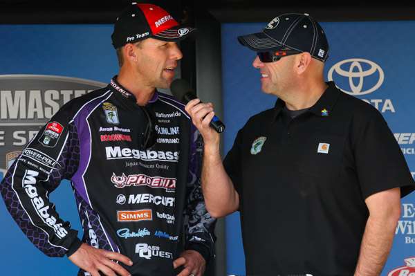 Emcee Dave Mercer talks with Martens about his day and his 8-pound kicker.