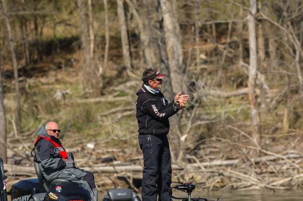 Browning looks on as he loads his crankbait rod up.